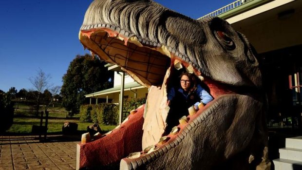 The National Dinosaur museum's T-rex was vandalised mid last year. Tour guide Krystal Collins examines the damage in this file photo.