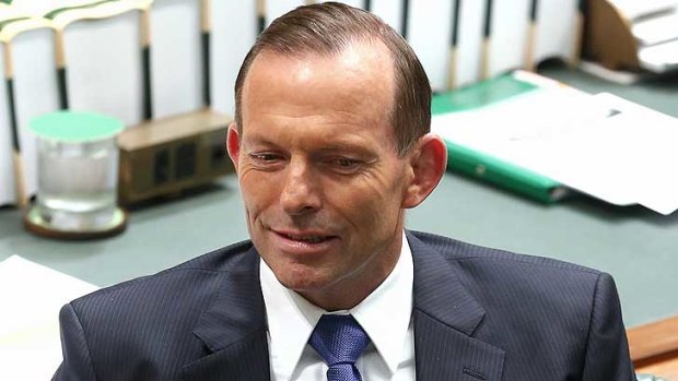 Prime Minister Tony Abbott looks askance in Parliament during Question Time.