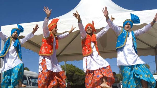 Footloose ... a swirl of colour by Sikh dancers at Woolgoolga.