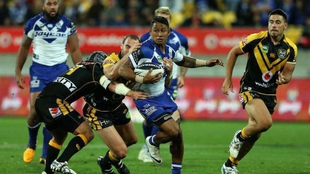 Unleashed: Ben Barba proves a handful for the Warriors defence at Wellington's Westpac Stadium.