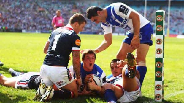 Oh yeah! ... Josh Morris can’t hide his jubilation after scoring the second of his four tries in the Bulldogs’ humiliation  of the Roosters yesterday at ANZ Stadium – Canterbury posted 12 touchdowns to Sydney’s three.