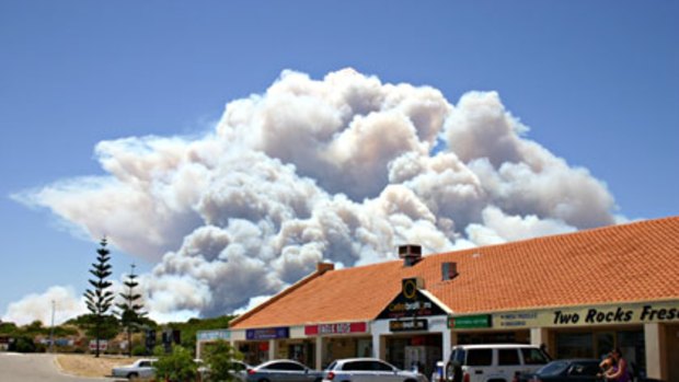 Smoke rises above Two Rocks in this photo sent in by the <A href=www.suncitynews.net.au>Sun City News</a>.