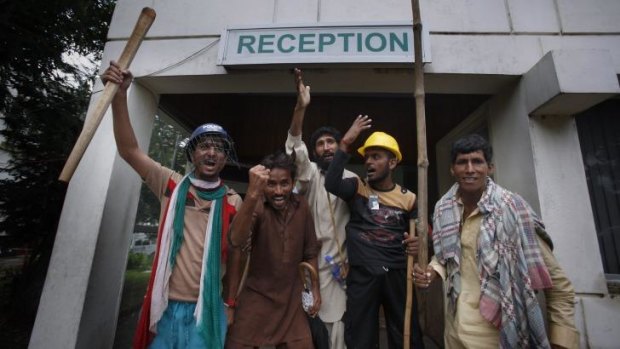 Pakistani protesters briefly shut down the state television station in Islamabad.
