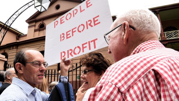 Protesters in front of NSW Parliament House demonstrating against the NSW government's privatisation of the Land Titles Registry.