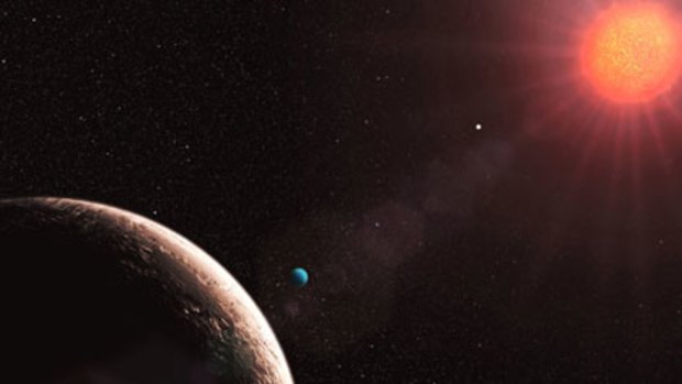 An artist's impression of "Planet e" , foreground left, which is only about twice the mass of Earth. Gliese 581 d, (coloured blue in image) is placed well within the habitable zone, where liquid water oceans could exist.