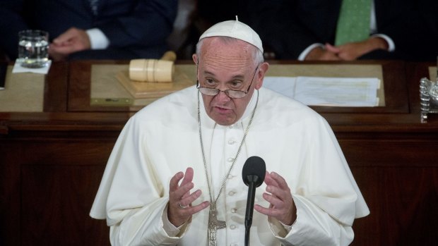 Pope Francis, pictured addressing a joint meeting of US Congress in September, has called for action on climate change. 