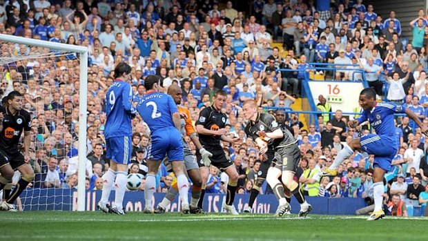 Scrappy ... Florent Malouda knocks home the controversial winner.