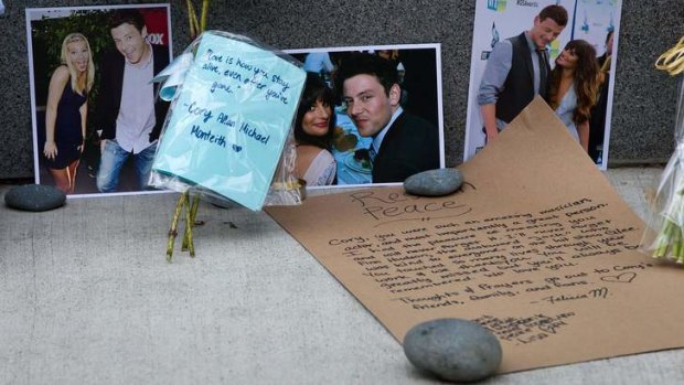 Photographs and notes are placed at a memorial for Canadian actor Cory Monteith outside the Fairmont Pacific Rim Hotel in Vancouver, British Columbia.