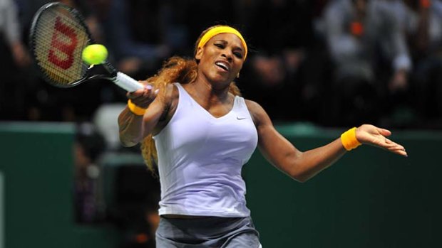 Serena Williams returns service to Jelena Jankovic during their WTA Championship semi-final in Istanbul.
