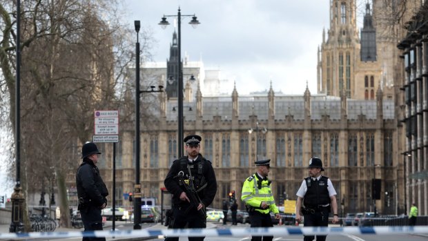 Armed officers at Westminster Bridge and the Houses of Parliament.