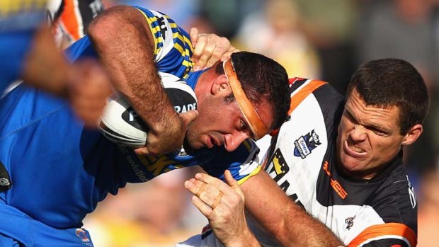 Tustle ... the Eels gave Wests Tigers a reality check in the final 15 minutes.