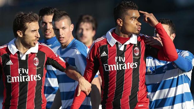 AC Milan midfielder Kevin-Prince Boateng (right) gestures towards the crowd in Busto Arsizio, near Milan, after racist chants were directed at AC Milan's black players.