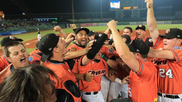 Canberra Cavalry players celebrate their win.