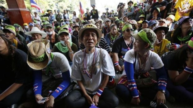 Anti-government protesters block the entrance to a government building in Bangkok on Wednesday.