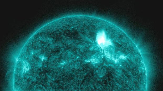 This colourised NASA image, taken on January 23  in a special teal wavelength, shows a flare shooting out of the top of the sun.