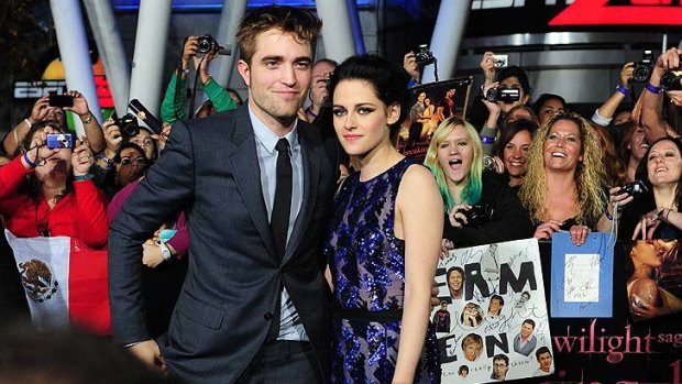 Robert Pattinson and Kristen Stewart arrive at  the world-premiere in Los Angeles.