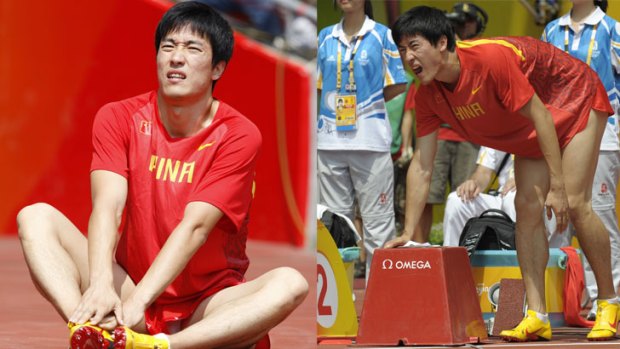 China's Xiang Liu retires from the first round of the men's 110m hurdles at the "Bird's Nest" National Stadium during the 2008 Beijing Olympic Games.