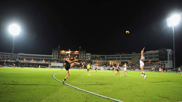 Oval and out: Port Adelaide's Brad Ebert kicks the winning goal in the exhibition match at The Oval in London, which was hotly contested between the Western Bulldogs and the Power.