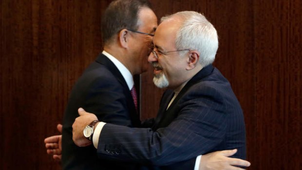 Charm offensive: United Nations Secretary-General Ban Ki-moon, left, is embraced by Iranian Foreign Minister Mohammad Javad Zarif at UN headquarters in New York.