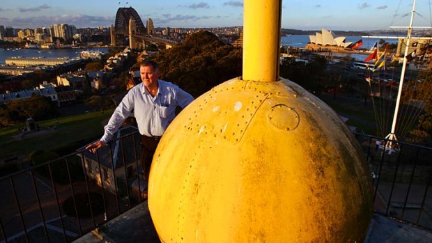 Significant: Sydney Observatory's education officer Geoffrey Wyatt with the time ball, which has dropped every day for 155 years except for two years when it was out of action and required new parts.