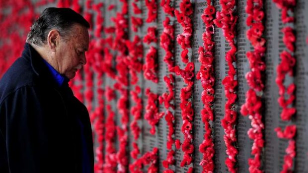 Australia's AFL Hall of Fame legend, Ron Barassi visits the Australian War Memorial to place a poppy against his father's name on the Roll of Honour.