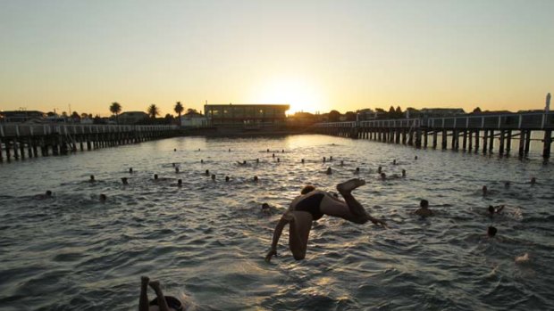 Saints players leap into the Brighton sea baths for a dawn swim.