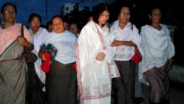 Indian rights activist Irom Sharmila (third from right), who was force-fed during her 14-year hunger strike, is accompanied by her supporters following her release from a hospital jail in Imphal, north-east India. 