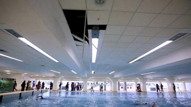 The disaster so far ... the collapsed ceiling of the warm-up area of the Shyama Prasad Mukherjee swimming complex.