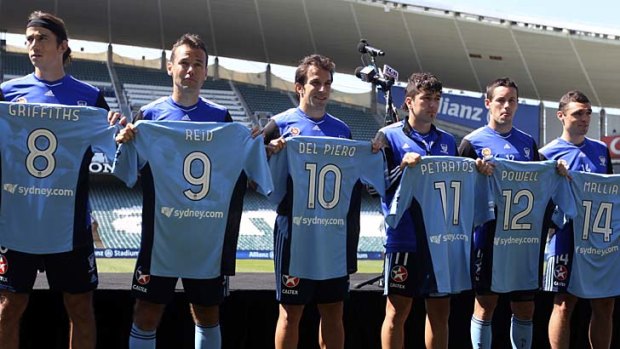 On display ... Alessandro Del Piero shows off his shirt alongside his new teammates.