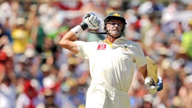 Michael Hussey celebrates scoring a century against England in Perth.