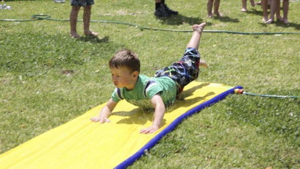 Entrant into The Canberra Times' summer photo competition. Noah Smith enjoying the slip-n-slide at his 5th birthday party.
