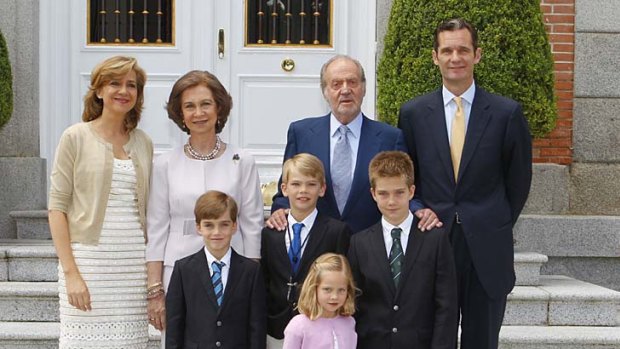 Royal family ...  King Juan Carlos I of Spain, back, second right, and Queen Sofia of Spain, back, second left, pose with Inaki Urdangarin, right, his wife Princess Cristina and their children.