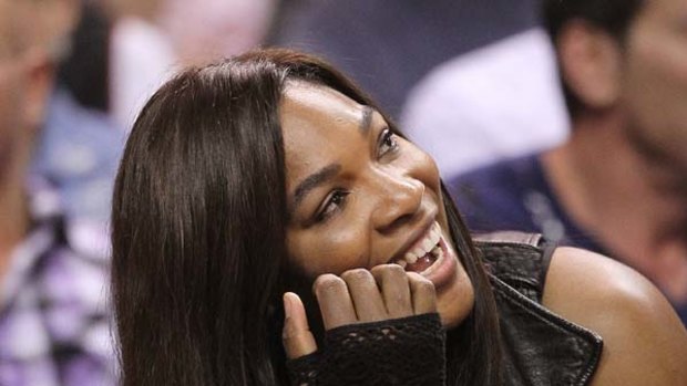 Serena Williams watches an NBA game between the Miami Heat and the Charlotte Bobcats in November last year.