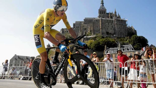 Race leader Chris Froome passes world heritage site Mont-Saint-Michel.
