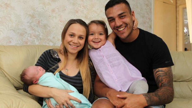 Doting father: South Sydney winger Dylan Farrell and Hayley Mundy with their children, Leilani, 3, and Derain, one week old.