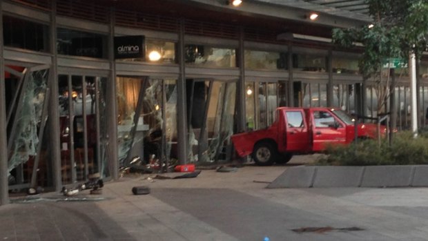 The ute smashed through the front windows of the cafe in Collins Street, Docklands.