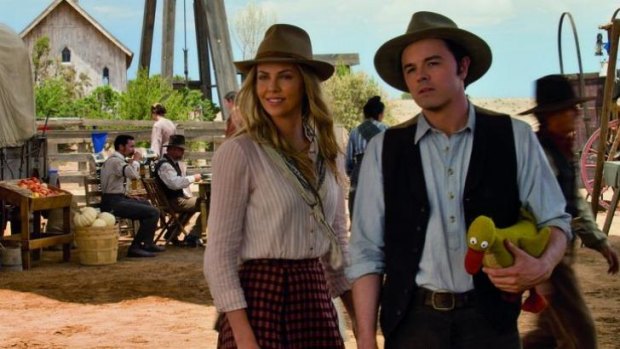 Charlize Theron and Seth MacFarlane in <em>A Million Ways To Die In the West</em>.