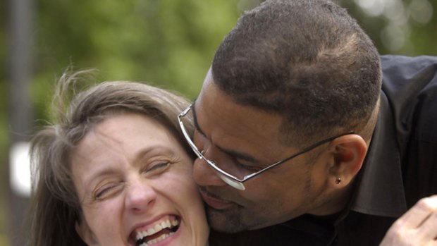 Debbie Purdy and her husband, Omar Puente, celebrate the news.