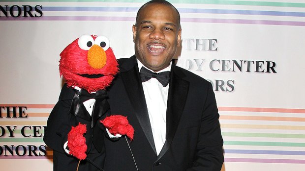 On leave ... Puppeteer Kevin Clash with Elmo. Clasj denies the allegations.