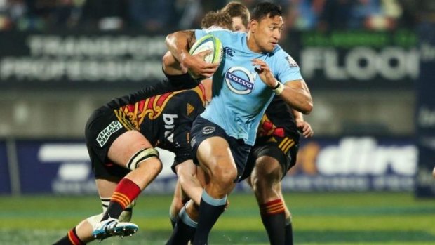 On the burst: Israel Folau makes a bust during the Waratahs' 33-17 win over the Chiefs in New Zealand.