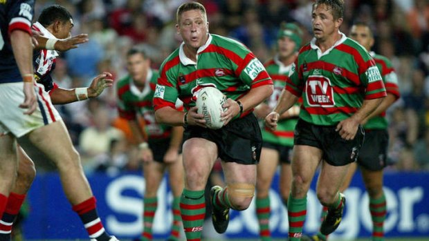 The clash of 2002: Adam Peek takes it up for Souths.