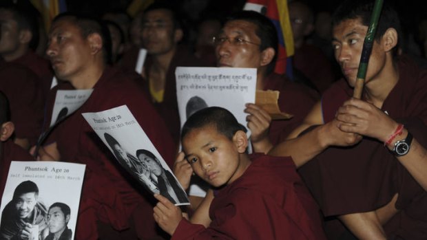 Tibetan Buddhist monks and nuns take part in a candlelight protest at temple in Dharamsala in March after the death of a young monk by self-immolation. Two more young monks died this week after setting themselves on fire in defence of their culture and heritage.