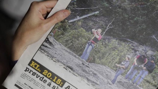 A Norwegian newspaper publishes photos of a restrained Anders Breivik re-enacting his slaughter of children on Utoeya.