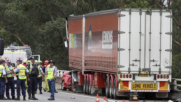 The wreck of the Falcon, crushed under the front of the truck on the Hume Highway at Menangle.