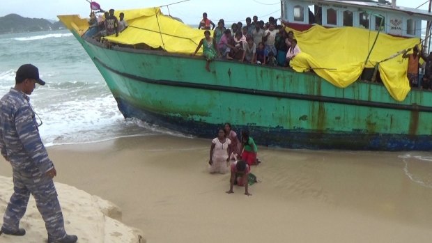 The Sri Lankan women disembark the boat against the orders of the Indonesian authorities.