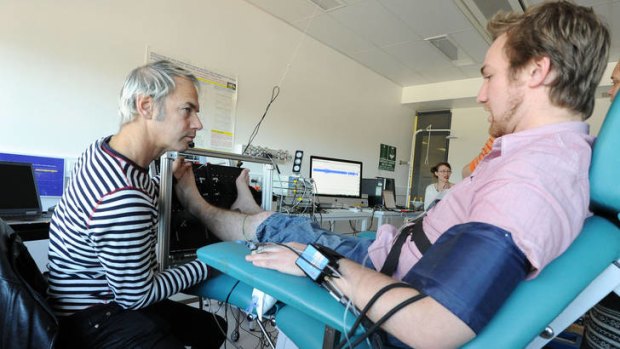 Researcher Vaughan Macefield, left, triggers nerve impulses from actor Ben Schultz, during an experiment at the University of Western Sydney.