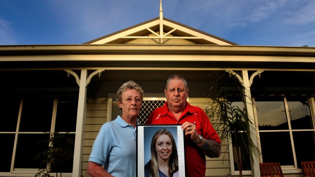 Pam and Max Greenbury hold a photo of their daughter, Tracey, who was killed by her boyfriend - a convicted murderer.