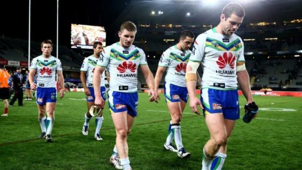 Embarrassed: Raiders players leave the field after another heavy defeat.