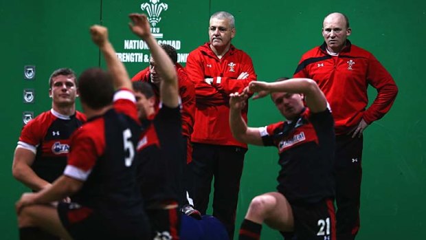 Back in charge ... head coach Warren Gatland of Wales looks on as the team stretches during a training session at the Vale resort.