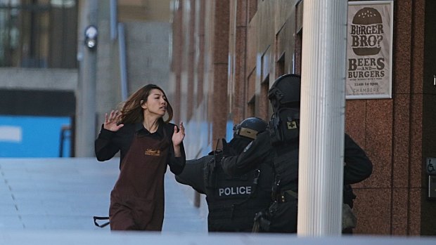 A Lindt cafe worker flees to safety.